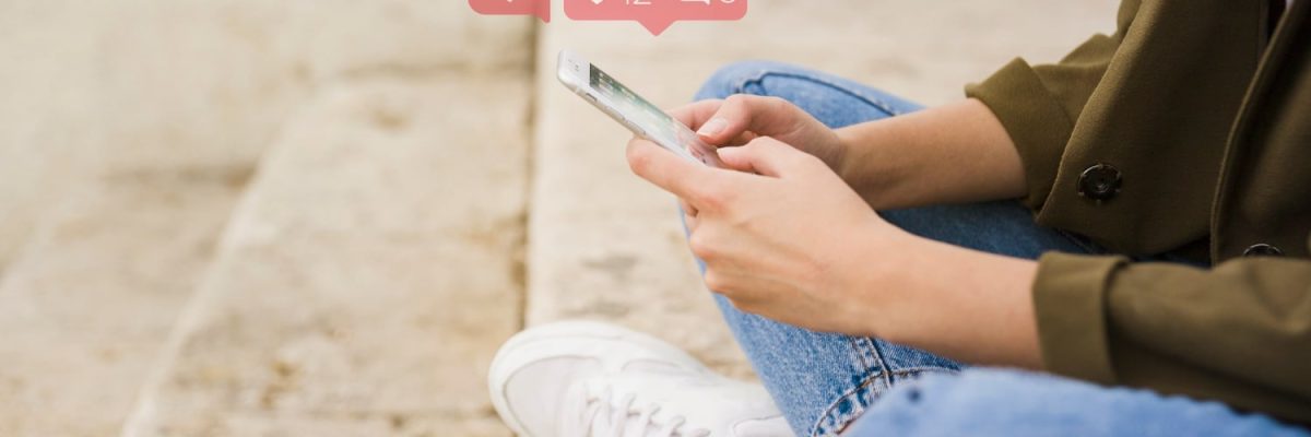 close-up-woman-sitting-stairs-using-social-media-app-mobile